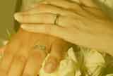 Hands with Wedding Rings with a gold filter